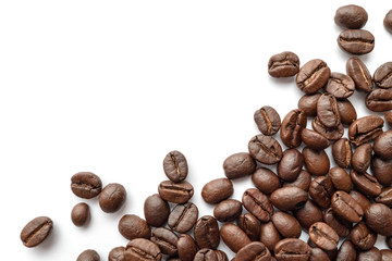 Roasted coffee beans isolated on white background. Close-up.