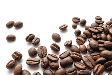 Roasted coffee beans isolated on white background. Close-up.