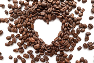 Heart frame of roasted coffee beans with area for copy space.