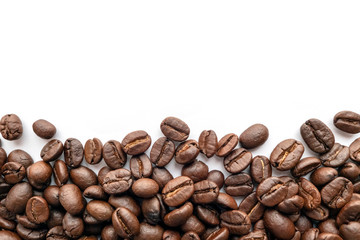 Roasted coffee beans on white background. Close-up.