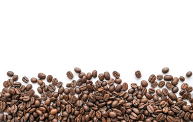 Roasted coffee beans on white background. Close-up.