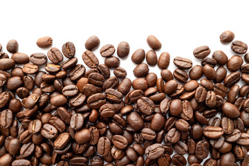 Roasted coffee beans on white background. Close-up.