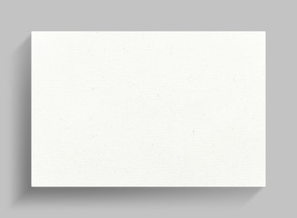 Canvas frame on gray wall background with soft shadow.