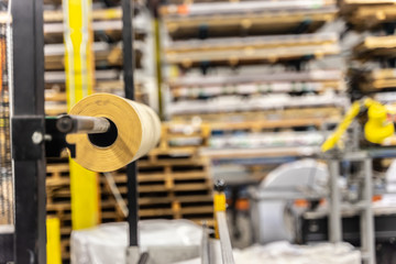 Roll of paper wrapping material in factory workshop packaging