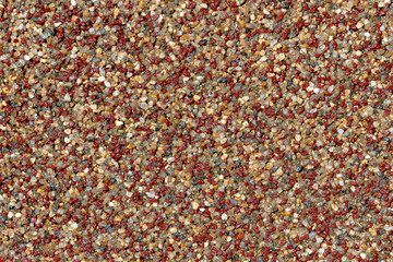 Texture decorative plaster on the basis of small colored marble stones and acrylic adhesive composition, close-up abstract background