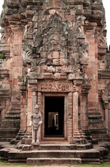Fototapeta na wymiar Carved stone facade and God guard of Phanom Rung castle in Buriram, Thailand