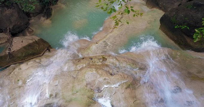 Cascades of waterfalls on water stream in tropical environment of Erawan national park, Thailand