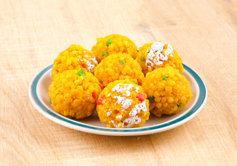 Laddu also know as laddoo, ladoo, laddo are ball-shaped sweets popular in the Indian festivals. Laddu are made of flour, minced dough and sugar with other ingredients.