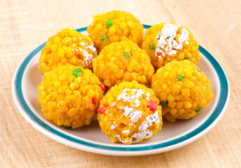 Laddu also know as laddoo, ladoo, laddo are ball-shaped sweets popular in the Indian festivals. Laddu are made of flour, minced dough and sugar with other ingredients.