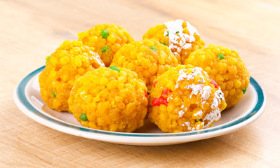 Laddu also know as laddoo, ladoo, laddo are ball-shaped sweets popular in the Indian festivals. Laddu are made of flour, minced dough and sugar with other ingredients.