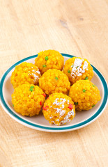 Laddu also know as laddoo, ladoo, laddo are ball-shaped sweets popular in the Indian festivals. Laddu are made of flour, minced dough and sugar with other ingredients.