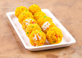 Laddu also know as laddoo, ladoo, laddo are ball-shaped sweets popular in the Indian festivals. Laddu are made of flour, minced dough and sugar with other ingredients.