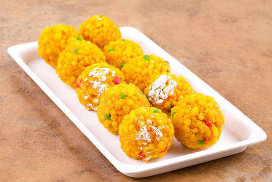 Premium Photo | Indian sweet motichoor laddooãƒâ‚ã‚â or bundi laddu made of  gram flour very small balls or boondis which are deep fried and soaked in  sugar syrup before making balls