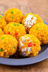 Laddu also know as laddoo, ladoo, laddo are ball-shaped sweets popular in the Indian festivals. Laddu are made of flour, minced dough and sugar with other ingredients.
