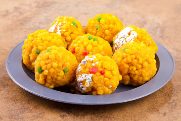 Laddu also know as laddoo, ladoo, laddo are ball-shaped sweets popular in the Indian festivals. Laddu are made of flour, minced dough and sugar with other ingredients.
