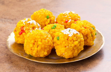 Laddu also know as laddoo, ladoo, laddo are ball-shaped sweets popular in the Indian festivals. Laddu are made of flour, minced dough and sugar with other ingredients.
