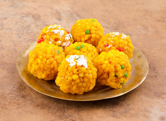 Laddu also know as laddoo, ladoo, laddo are ball-shaped sweets popular in the Indian festivals. Laddu are made of flour, minced dough and sugar with other ingredients.