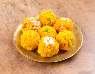 Laddu also know as laddoo, ladoo, laddo are ball-shaped sweets popular in the Indian festivals. Laddu are made of flour, minced dough and sugar with other ingredients.
