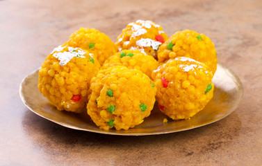 Laddu also know as laddoo, ladoo, laddo are ball-shaped sweets popular in the Indian festivals. Laddu are made of flour, minced dough and sugar with other ingredients.