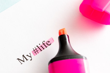 tag life is written on white paper, my life is highlighted by a pink marker lying next