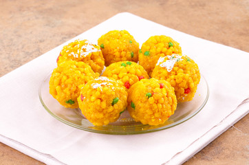 Laddu also know as laddoo, ladoo, laddo are ball-shaped sweets popular in the Indian festivals. Laddu are made of flour, minced dough and sugar with other ingredients.