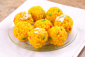 Laddu also know as laddoo, ladoo, laddo are ball-shaped sweets popular in the Indian festivals. Laddu are made of flour, minced dough and sugar with other ingredients.