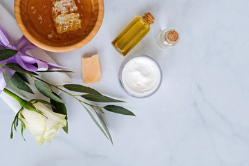 Spa natural skin care products background with space, cosmetic products - cream, oil and honey creative layout