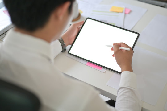 Businessman Working With Mockup Tablet And Digital Pen On Empty Monitor Tablet.