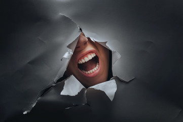 Panic on the woman's face. Anger and despair. The concept of torment, cry, pain and scream.