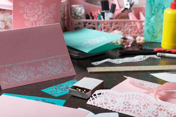 Making greeting cards from paper, cardboard and tape.