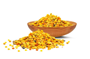 pollen in a wooden bowl isolated on a white background