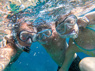 Underwater view of snorkeling friends