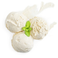 Vanilla ice cream ball with fresh mint leaf isolated on white background, macro