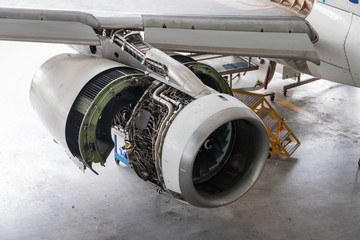 Aircraft engine being maintenanced in a hangar