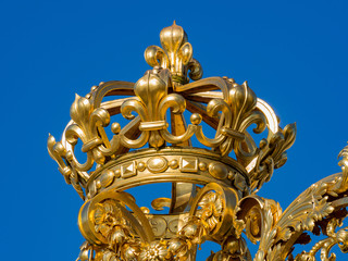 The golden entrance gate of the famous Palace of Versailles