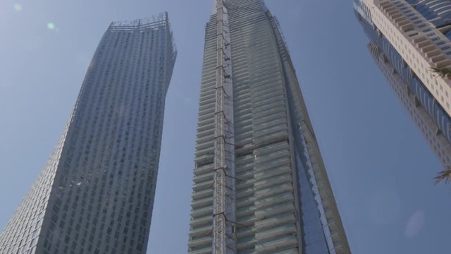 The Cayan Tower and neighbouring residential buildings in Dubai Marina, Dubai, United Arab Emirates, Middle East, Asia