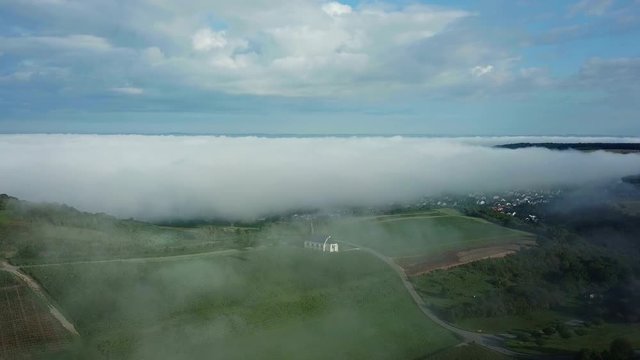Aerial view of St. Rochus Chapel in the vineyards near Nittel with fog, Obermosel, Moselle Valley, Rhineland-Palatinate, Germany