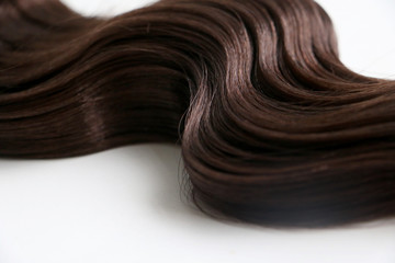 Lock of beautiful healthy brown hair