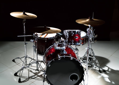 Professional drum set on stage on the black background 