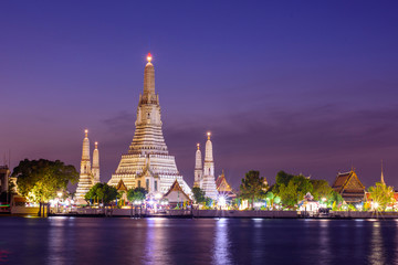 Wat Arun Ratchawararam Ratchawaramahawihan with reflections on the river in sunset time