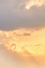 Beautiful clouds at sunset. The sun's rays pass through the clouds. 