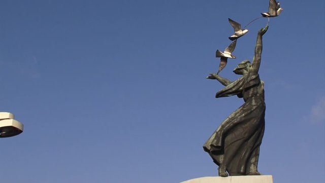 The Woman with Pigeons sculpture at the surface tube station Dnepr, Kiev, Ukraine, Europe