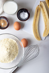 Ingredients for baking flour, eggs, milk and space for text.