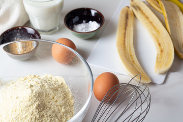 flour, eggs, banana, milk close up.