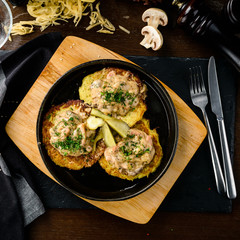 homemade potato pancakes, Vegetable fritters. Latkes in frying pan