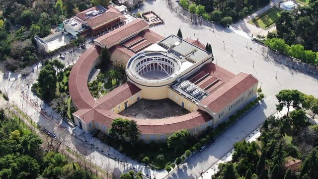 Aerial drone video of neoclassical public masterpiece, Zapeion building in National Gardens, Athens, Attica, Greece