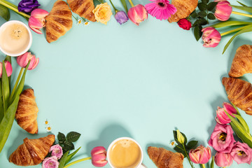 Morning coffee, croissants and a beautiful flowers. Flat lay