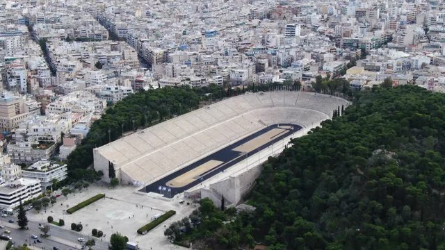 Aerial drone video of iconic ancient Panathenaic stadium or Kalimarmaro built by Athenians on 330 BC primarily for the Panathenaic Games, Athens historic centre, Attica, Greece 