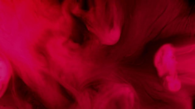 abstract red smoke waves moving at dark background 