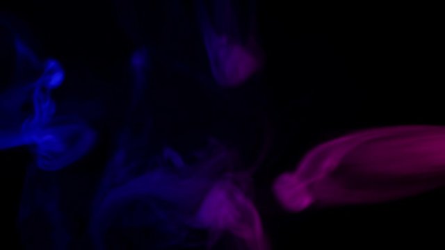 abstract red and blue smoke waves at dark background 